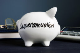 Superannuation,written,on,a,white,piggy,bank.